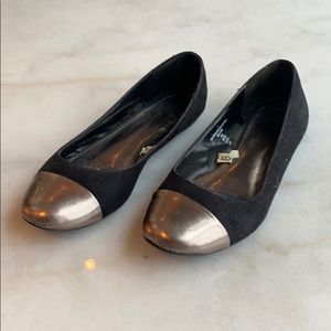 Silver toed black flats